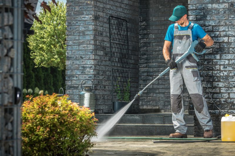 Powerwashing Technician Operating Equipment